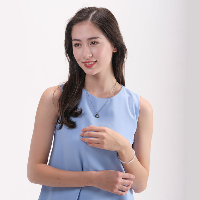 Phiten Stainless Necklace with Numeric Ring Paired with Formal Attire