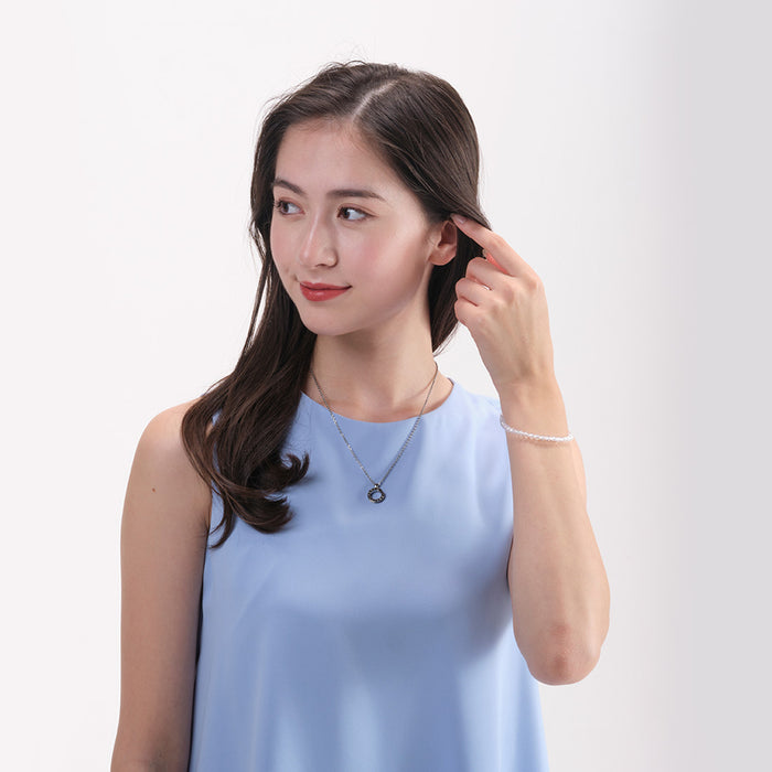 Model Wearing Phiten Stainless Necklace with Numeric Ring Pendant